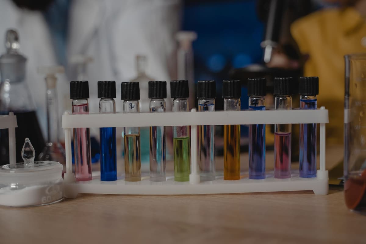 Close-up of test tubes with colored liquids in a laboratory setting