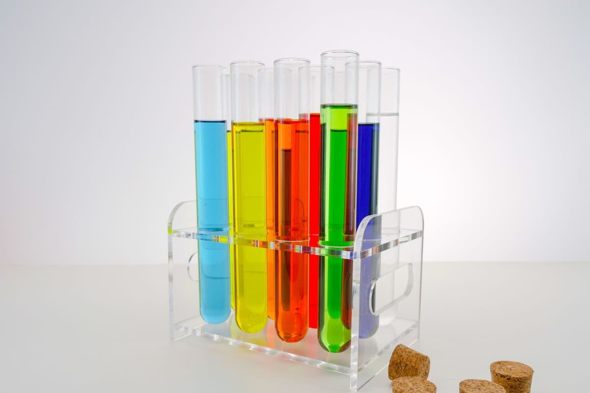 Colorful test tubes with various liquids in a laboratory setting, showcasing scientific research and experimentation