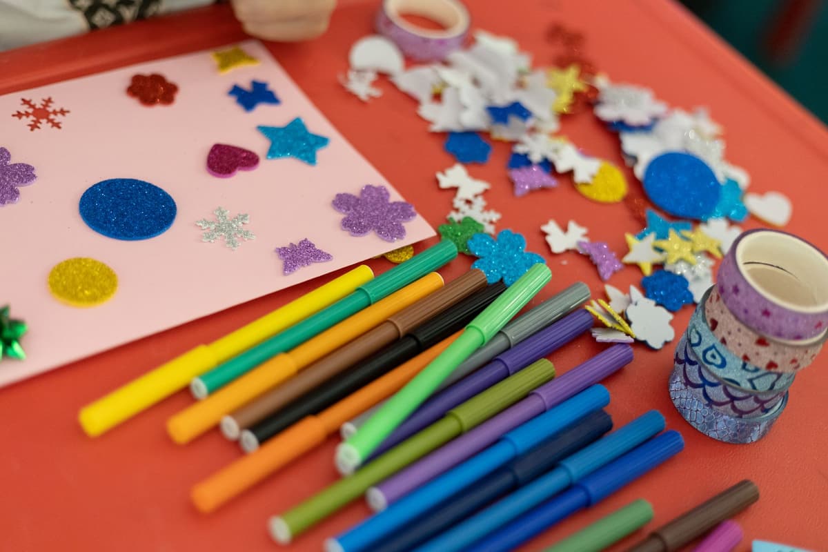 A vibrant assortment of arts and crafts materials on a table, perfect for creativity and decoration projects