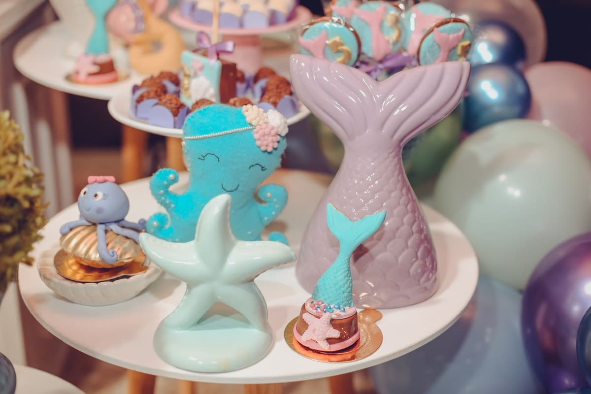 Underwater-themed party table with mermaid and sea creature decorations